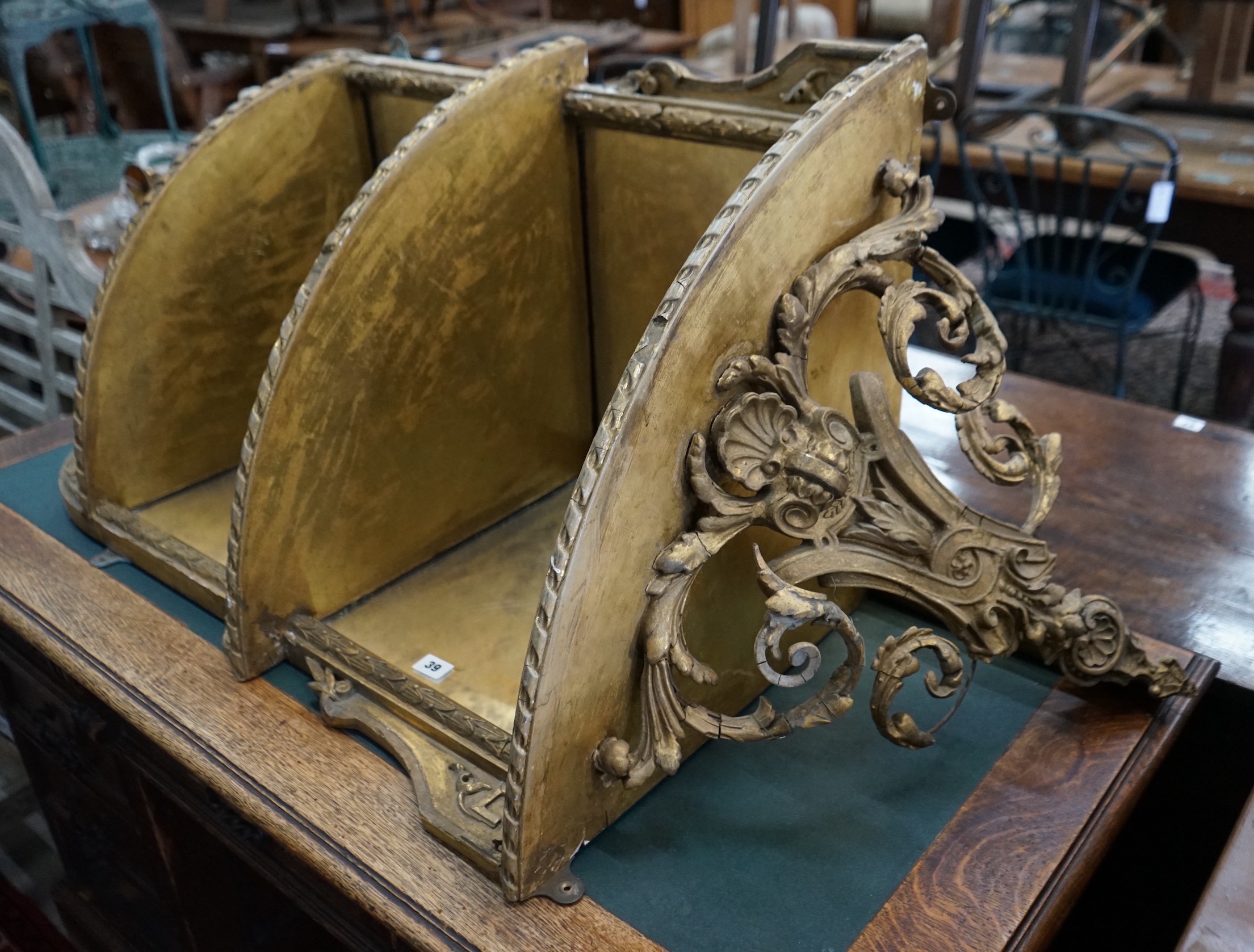 A Victorian giltwood and gesso mirrored corner wall bracket, width 74cm, depth 45cm, height 140cm